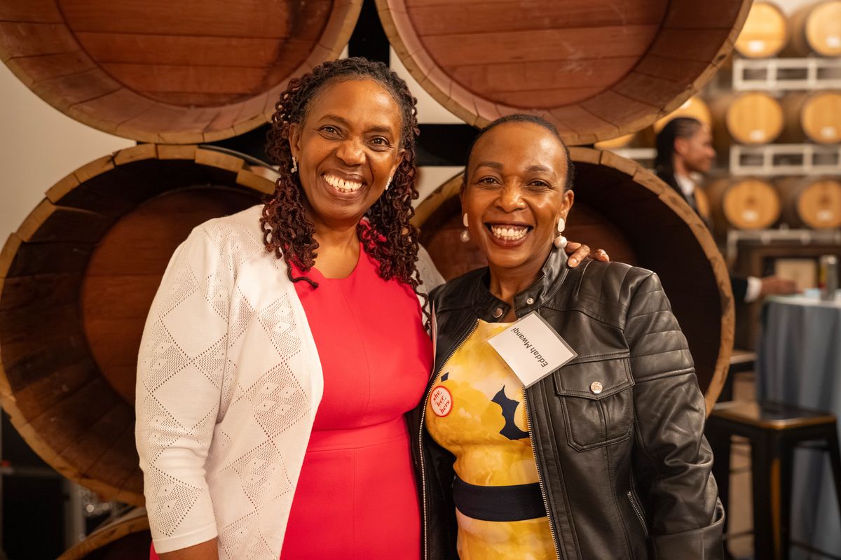 Two guests smiling at the gala