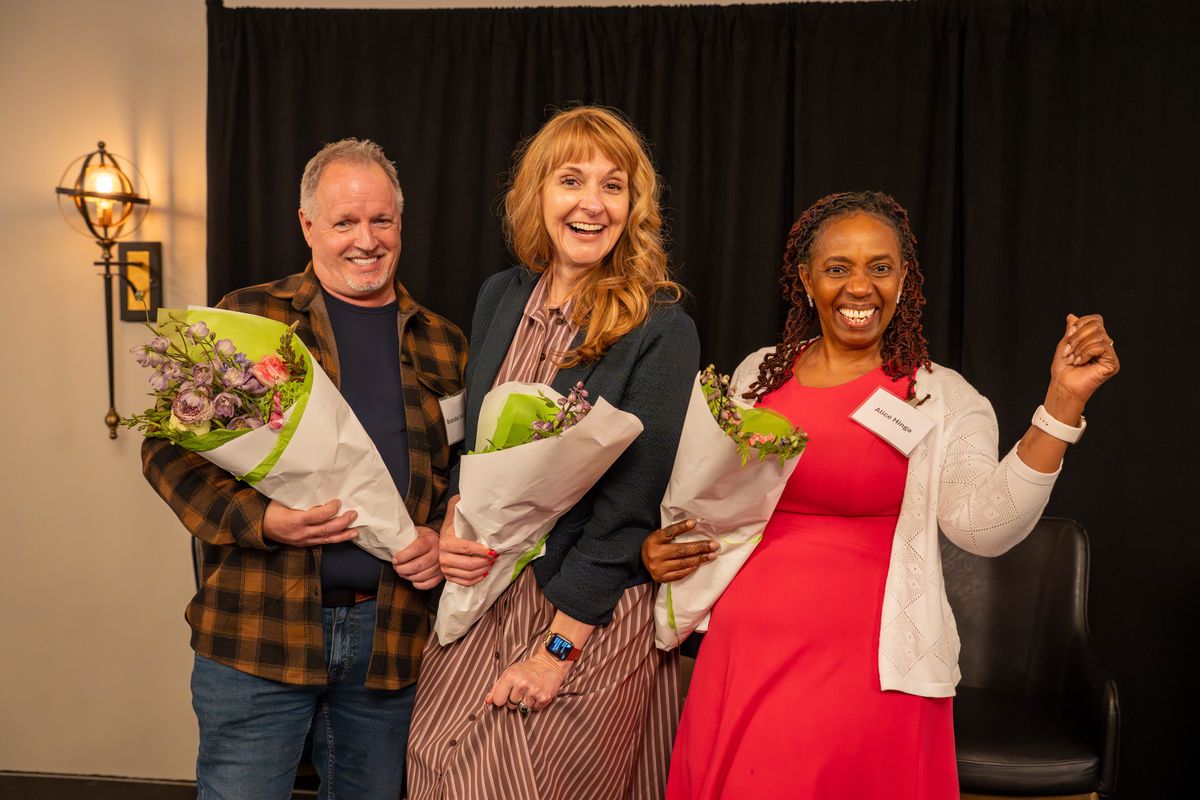 Honorees celebrating with flowers